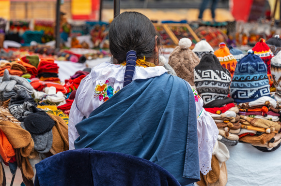 Indigenous woman at a market stall in Ecuador