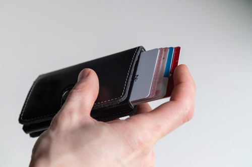 Mans hand holding RFID blocking wallet