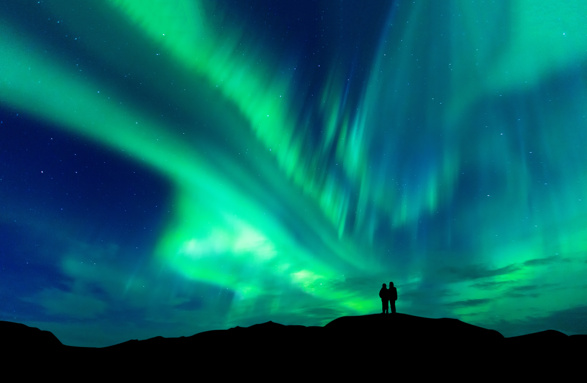 Couple under the Aurora Borealis in Iceland