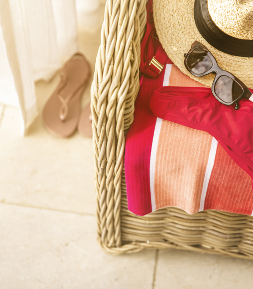 Sunglasses, headphones and a hat on a chair