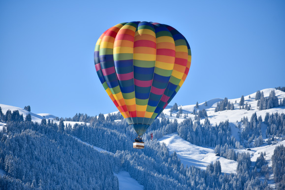 Hot air balloon above the mountains in Switzerland