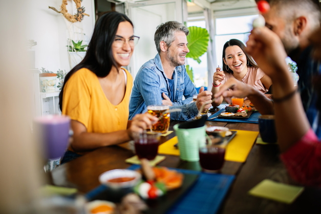 A group of friends at a table in a restaurant