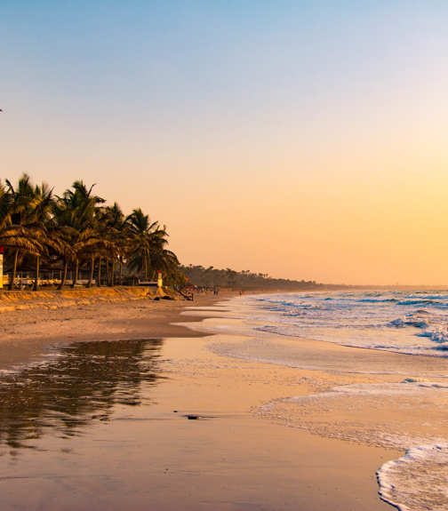 Enjoying the sunset on an idyllic beach in the Gambia, West Africa