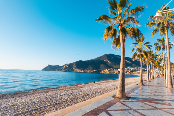 View to beautiful Albir town with main boulevard promenade, seaside beach and Mediterranean sea.
