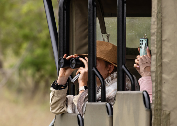 People sitting in open safari vehicle, South Africa